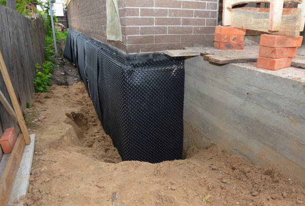Happy homeowners after waterproofing job in Buhl
